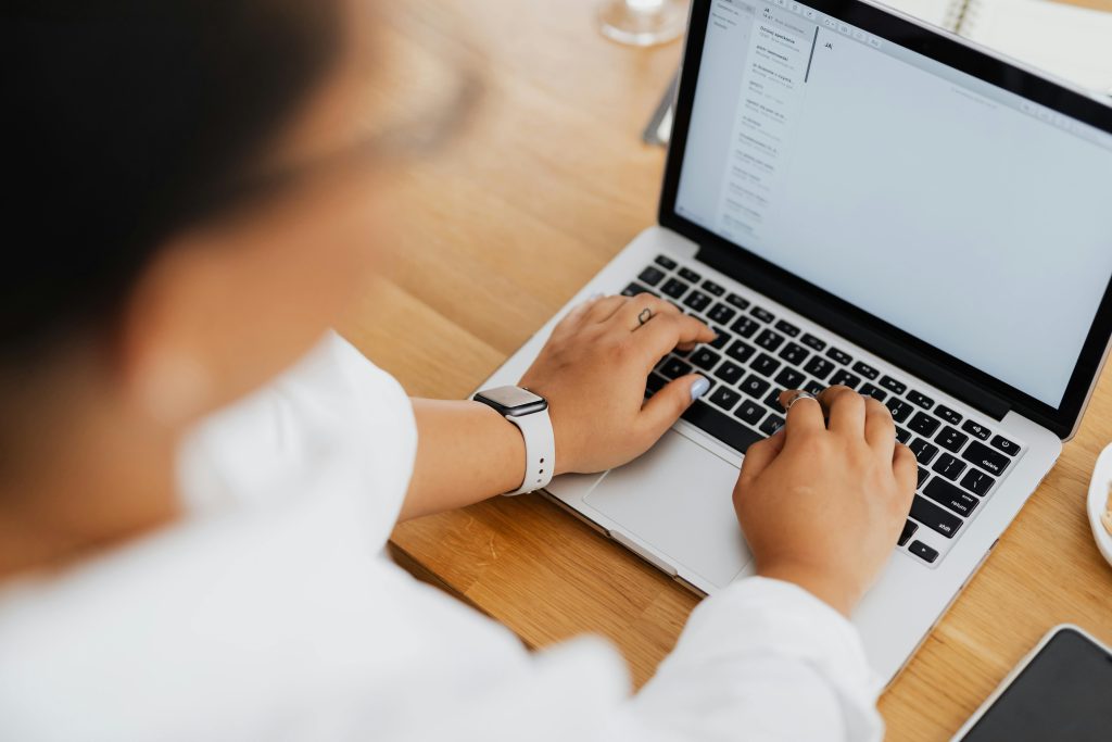 person typing on a laptop